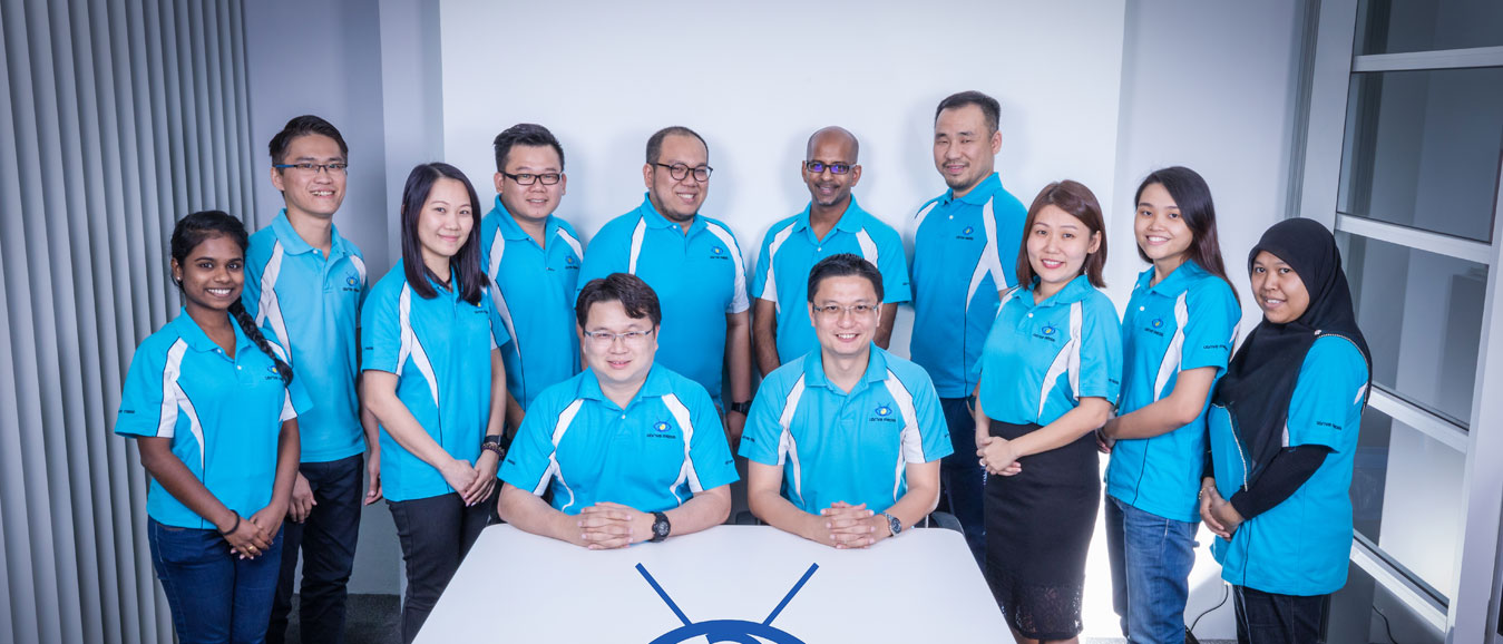 UDrive Media colleagues in company shirts at the office