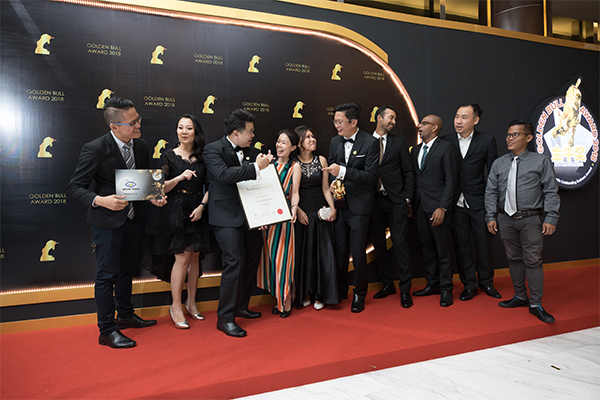Award recipients together on the event stage