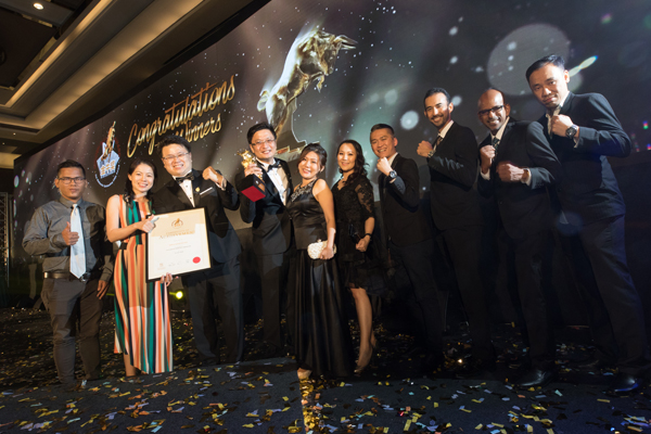 UDrive team receiving recognition on stage at the Golden Bull Award event