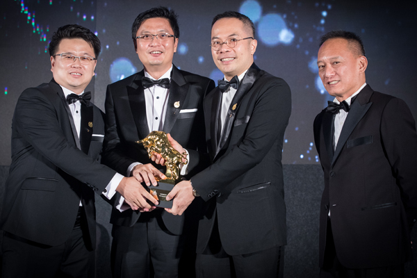 UDrive team members holding the Golden Bull Award trophy
